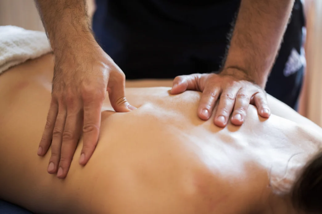 Massage therapist working on a client’s back